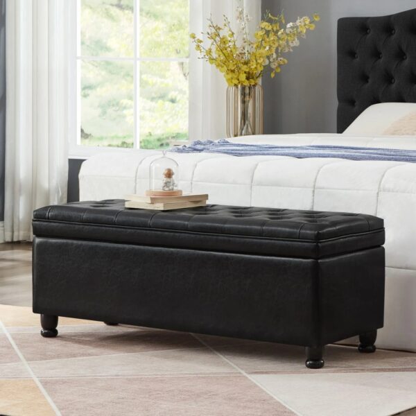 black-faux-leather-tufted-storage-bench-in-bedroom