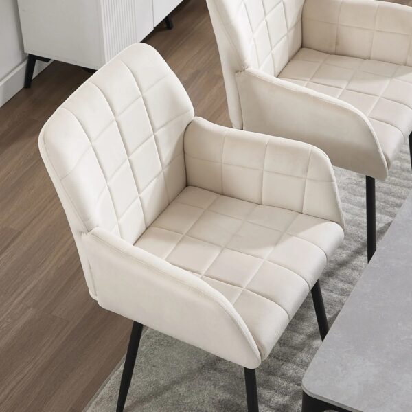 cream-velvet-dining-chairs-with-armrests-set-at-table