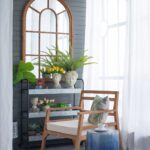 large-arched-window-brown-wood-wall-mirror-room-view
