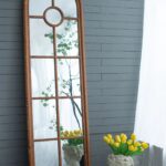 tall-arched-window-wood-frame-wall-mirror-room-view