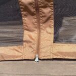 portable-pop-up-gazebo-brown-mesh-sandbags-close-up.jpg